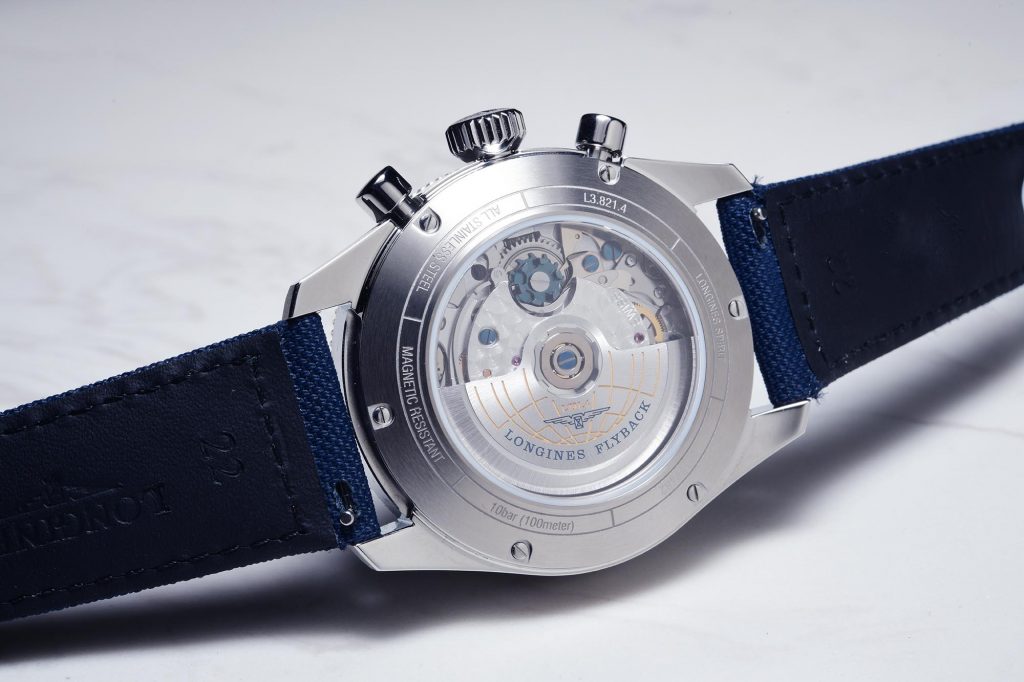 Exhibition Caseback on the Longines Spirit Flyback Chronograph showing the movement and the rotor etched with the globe and "Longines Flyback"
